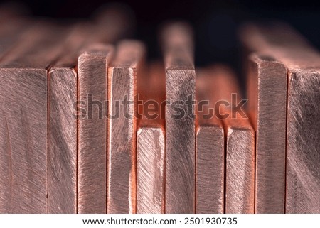 Row of copper flat bars close-up view