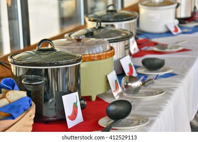 Row Of Crock Pots For Chili Cook Off Contest In Restaurant