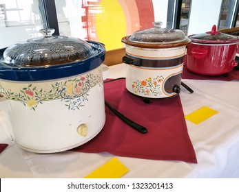 Row Of Crock Pots In Restaurant Chili Cook Off Competition