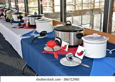 Row Of Crock Pots In A Restaurant For Chili Cook Off