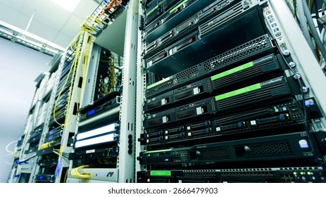 Row of data servers in modern facility, perfect for cloud computing and tech infrastructure.