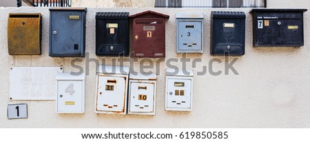row of different mailboxs