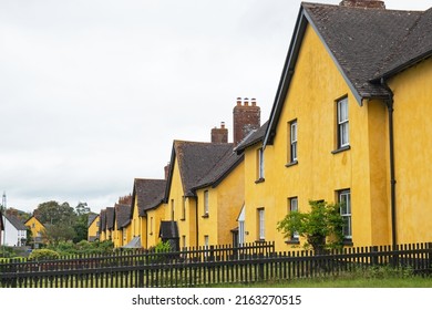 A row of distinctively painted cottages in an East Devon village, UK