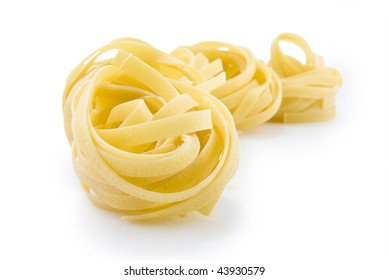 row dry nest pasta on white - Powered by Shutterstock