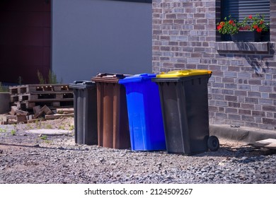 row of dustbins for recycling waste