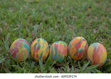 Row of Easter eggs in Fresh Green Grass.