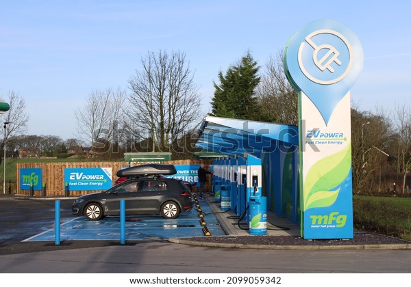Row of electric charging points for cars at Wrightington\
garage adjacent to junction 27 M6 Lancashire. 31-12-2021,\
Lancashire UK, 