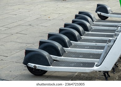 Row of electric scooters for public share. Electric urban transportation - Shutterstock ID 2364721005