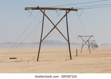 Row Of Electricity Pylons In The Namib Desert, Namibia, Africa