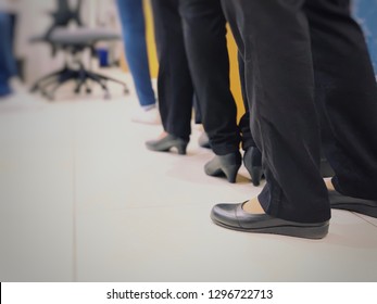 Row Of Employees Women In Queue For Waiting Something In Line. Feet Of Businesswoman Wearing Formal Wear Elegant Suits Standing In Row. Close Up Leg