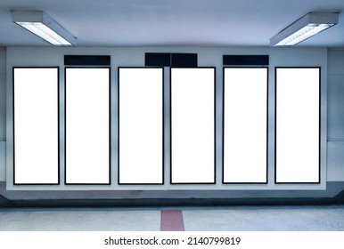 Row Of Empty Digital Vertical Billboard On Wall In Subway