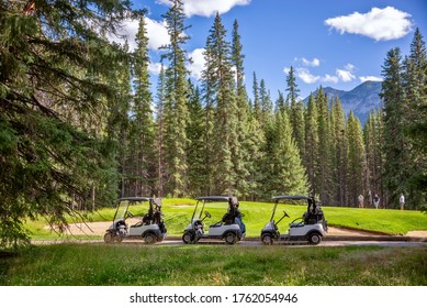 Row Of Empty Electric Carts On The Side Of The Golf Course, In Banff, Alberta, Canada