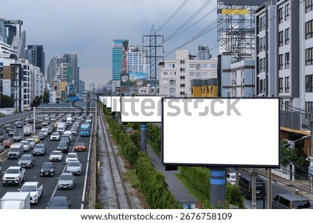 Row empty medium digital media billboard display on white background are installed on side of expressways on city so that motorists on highway can see advertisements on daylight with sky and cloud