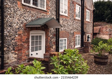 A row of English flint stone cottages.