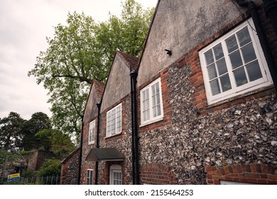 A row of English flint stone cottages.