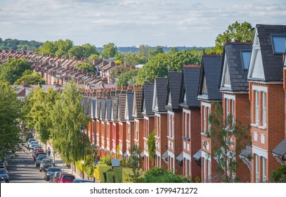 Row of English terraced houses on hilly area in Crouch End, North London