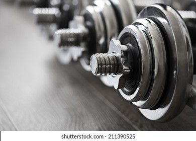 row of fitness dumbbells