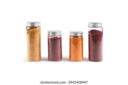 Row of four spice glass jars with colored spices isolated on white background  - Powered by Shutterstock