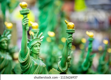 Row With Generic Statue Of Liberty Statues (selective Focus) Sold As Souvenirs In A NYC Shop. 