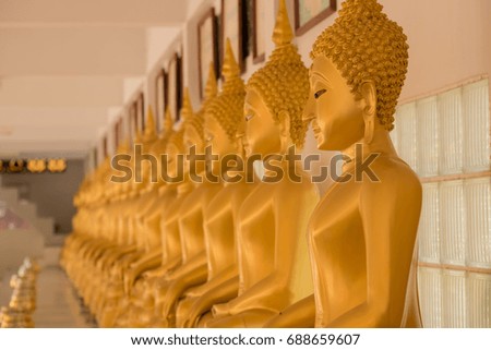Row of Golden Buddha in Thailand,Selective focus point on Buddha statue