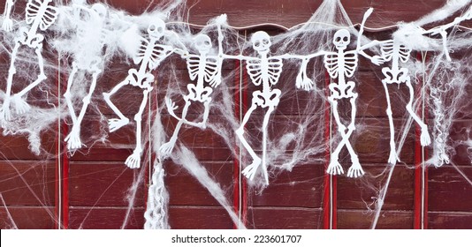 Row of hanging skeletons for Halloween - Powered by Shutterstock