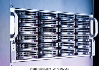 Row of hard drives serving as data storage inside server room