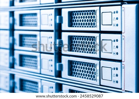 Row of hard drives serving as data storage inside server room