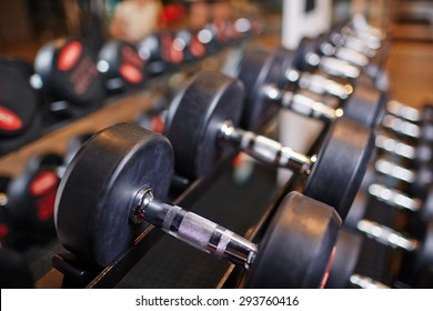 Row Of Heavy Barbells In Sports Club