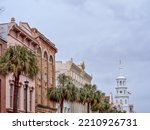 Row of houses on Broad Street with St Michael`s church on the background, Charleston, SC. 