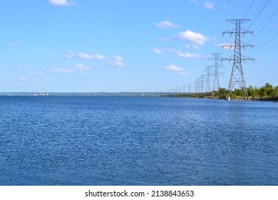 Row Of Hydro Towers Along Shore Of Lake Ontario During Spring