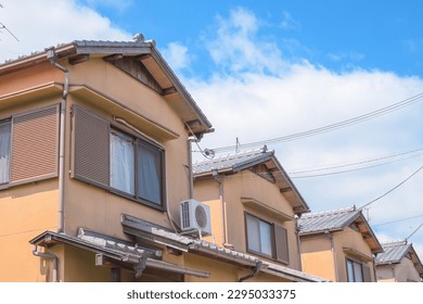 Row of Japanese houses with blue in Osaka Japan - Shutterstock ID 2295033375