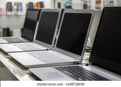 A Row Of Laptops In Computer Shop. Closeup, Selective Focus