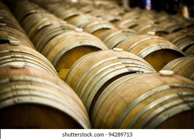 Row Of Large French Oak Red Wine Barrels In A Wine Warehouse