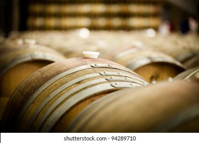 Row Of Large Imported French Oak Wine Barrels At A Winery