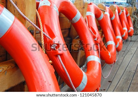 row of life buoys on boat