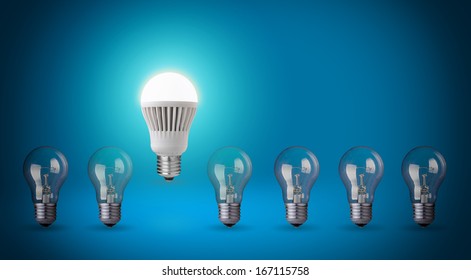 Row with light bulbs and LED bulb. Idea concept on blue background