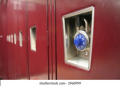 A row of lockers with the focus on the lock of the first one.