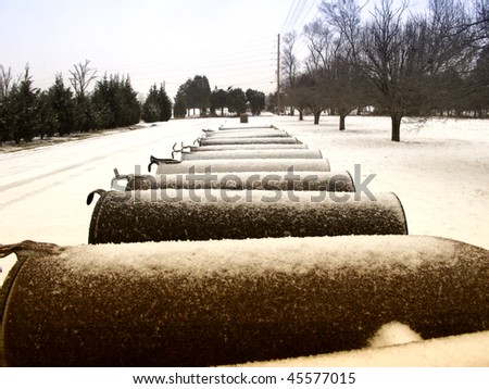 A row of mailboxes covered in snow from a late winter storm
