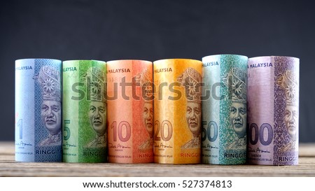Row of Malaysia Ringgit on wooden table