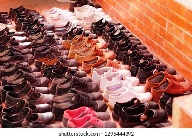 Row Of Many Thai Students Shoes Put On The Floor, So Neat And Tidy.