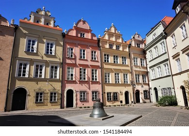 A row of medieval, pastel colored buildings or houses in the old town of Warsaw, Poland
