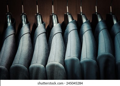 Row Of Men Suit Jackets On Hangers