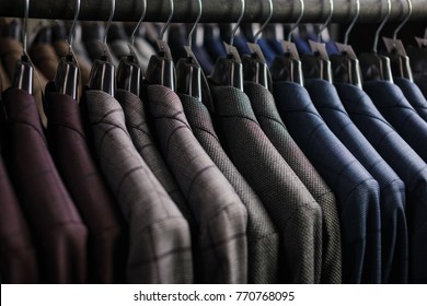 Row Of Men Suit Jackets On Hangers