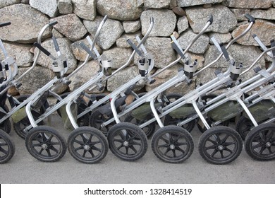 A Row Of Metal Push Pull Golf Carts Lined Up And Ready To Go Golfing 