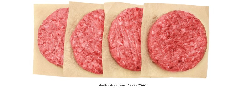 Row Of Minced Steak Burgers From Beef And Pork Meat Isolated On White Background, Overhead View. Uncooked Round Patties For Grilling From Ground Beef And Pork. Homemade Burgers For BBQ Grill, Top View