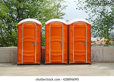 Row of mobile toilets in an urban area