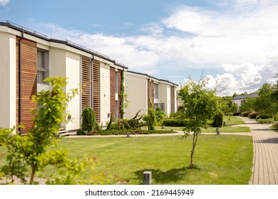 Row Of Modern Cottages. Brand New Row Of Single Family Houses. Modern Design Of Urban Living Residences With Private Courtyards, Sophisticated Finishes, New Development. Green Outdoor Facilities, Lawn