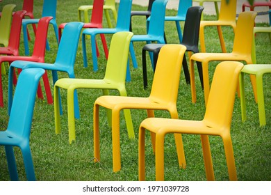 Row Of Multicolored Empty Chairs For An Outdoor Event