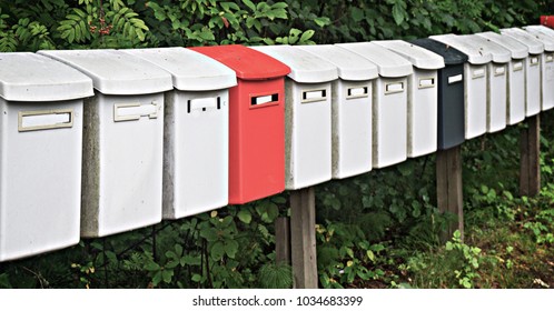 Row multicolored postboxes in the park