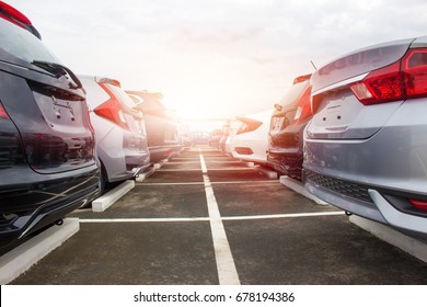A row of new cars parked at a car dealership stock - Shutterstock ID 678194386